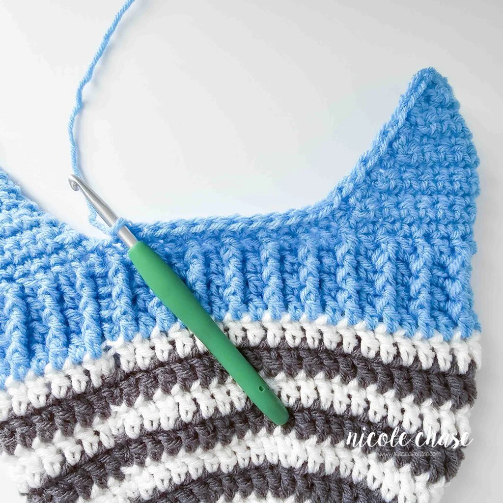Crocheting around the brim on the Spirit Earflap beanie crochet pattern free. 
