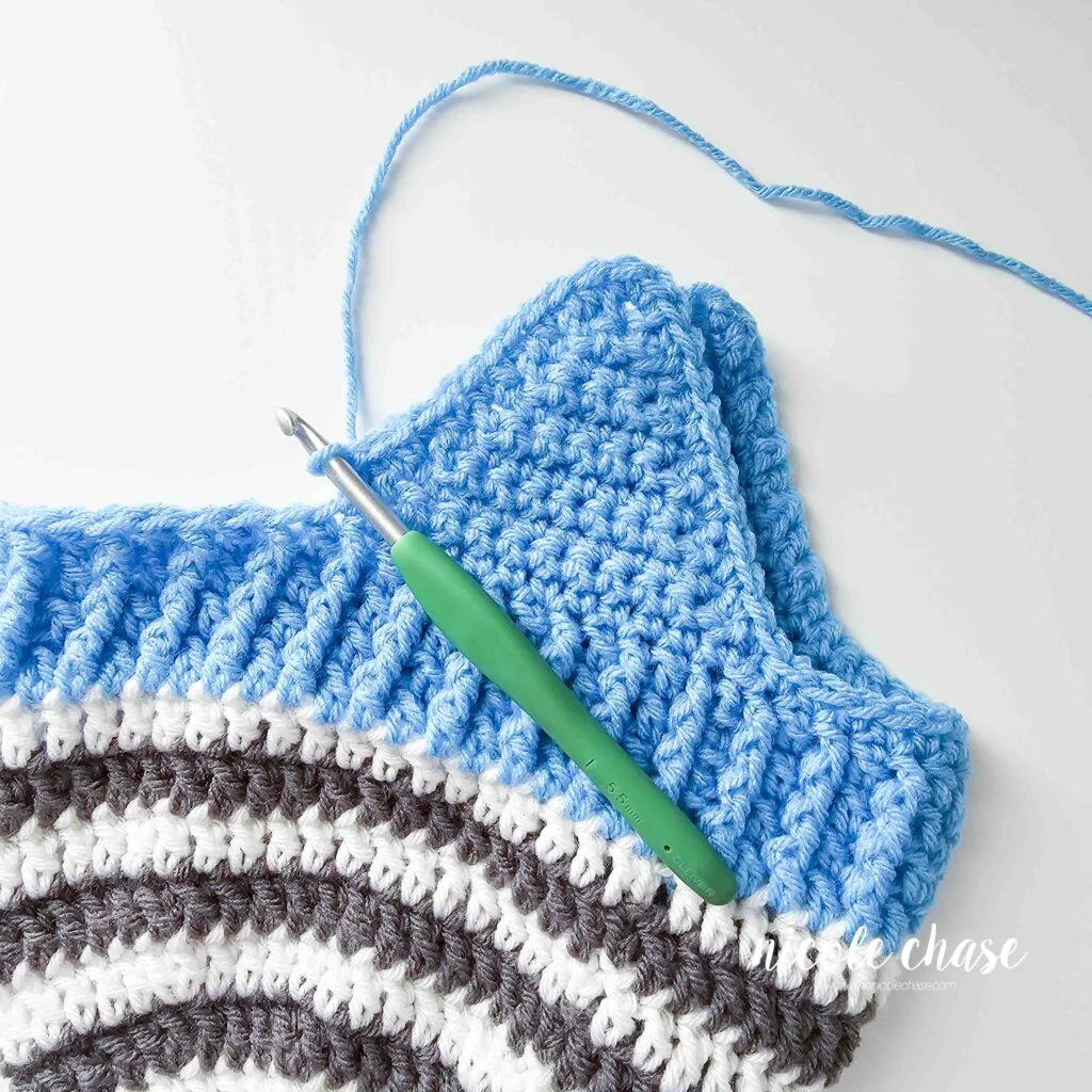 Crocheting around the second earflap of the free earflap beanie crochet pattern. 