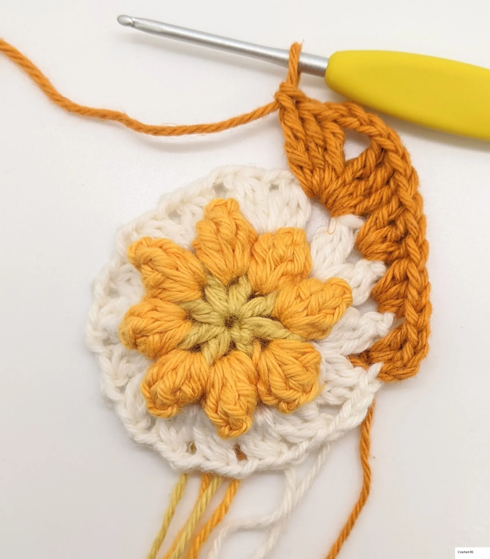 Granny square after forming the first corner.