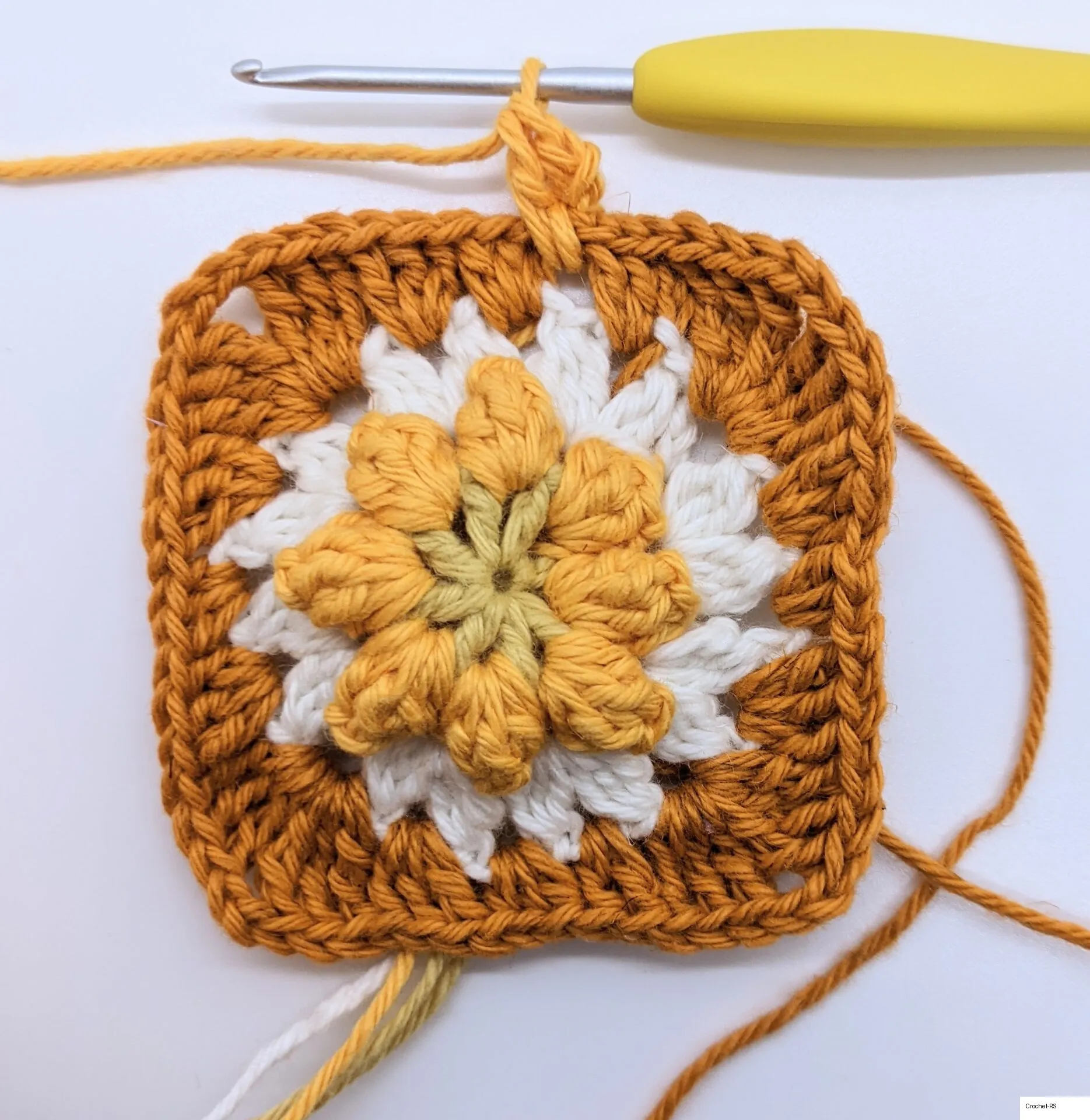 Granny square after finishing round 4.